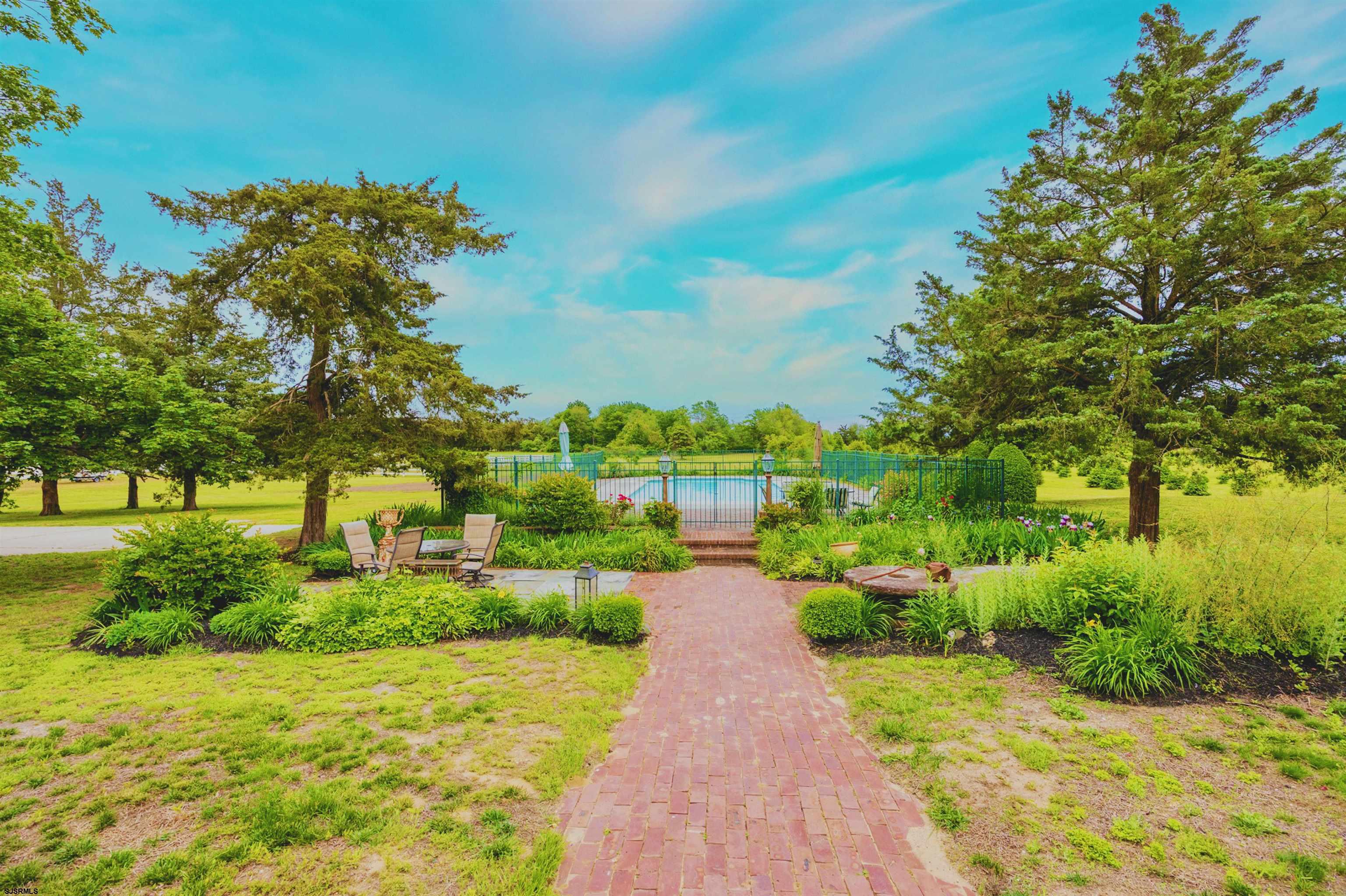3065 North Route 9 Ocean View, NJ 08230 - Photo 8 of 99 a view of a garden with a building in the background