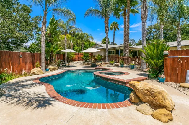 a view of a swimming pool with a patio