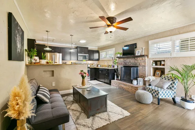 a living room with furniture and a fireplace