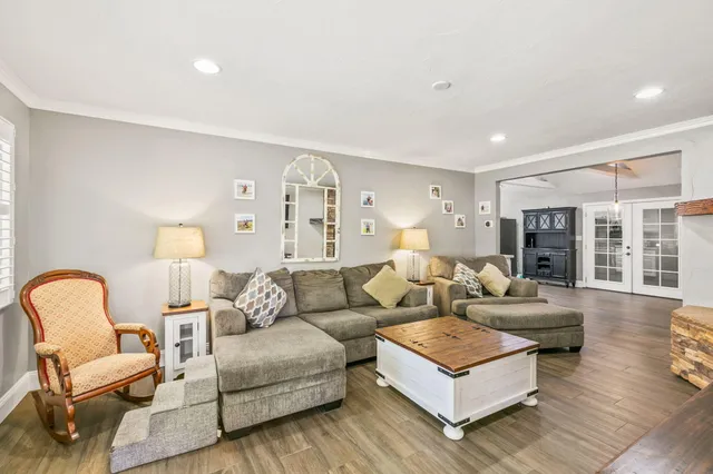 a living room with furniture and a large window