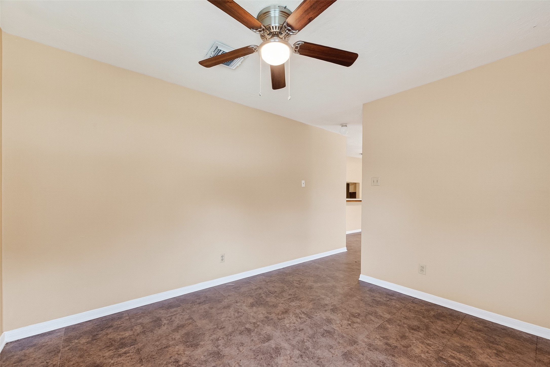 4826 Redfish Reef Drive Bacliff, TX 77518 - Photo 5 of 25 an empty room with a ceiling fan and a window