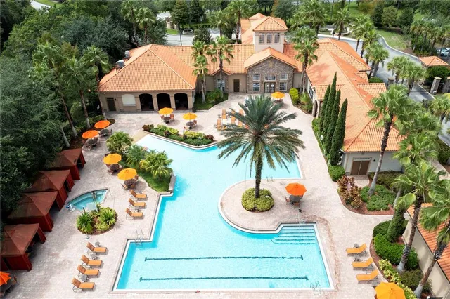 a front view of house with yard and trees