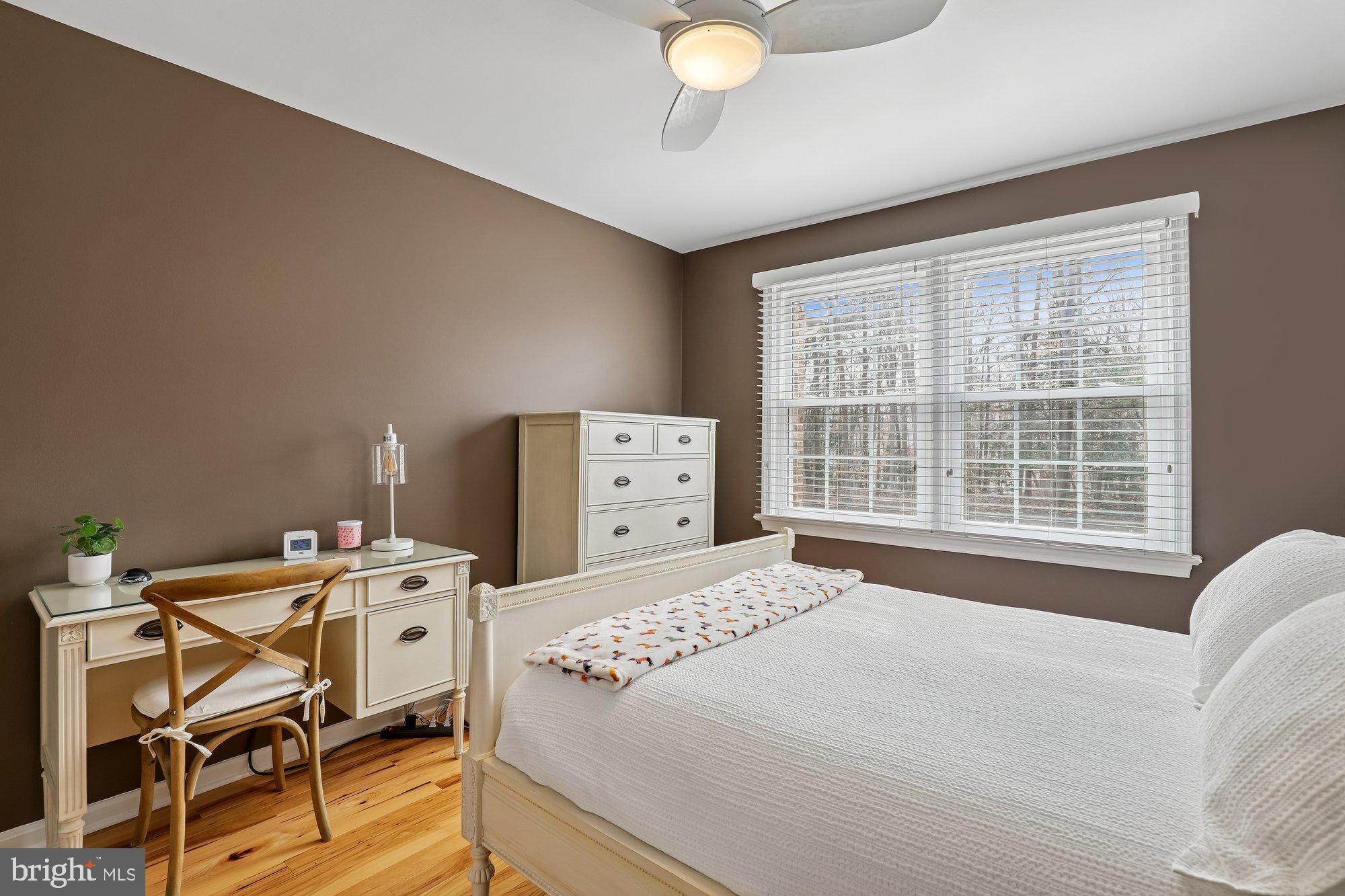 8019 Galla Knoll Circle Springfield, VA 22153 - Photo 33 of 57 a bedroom with a bed and a table
