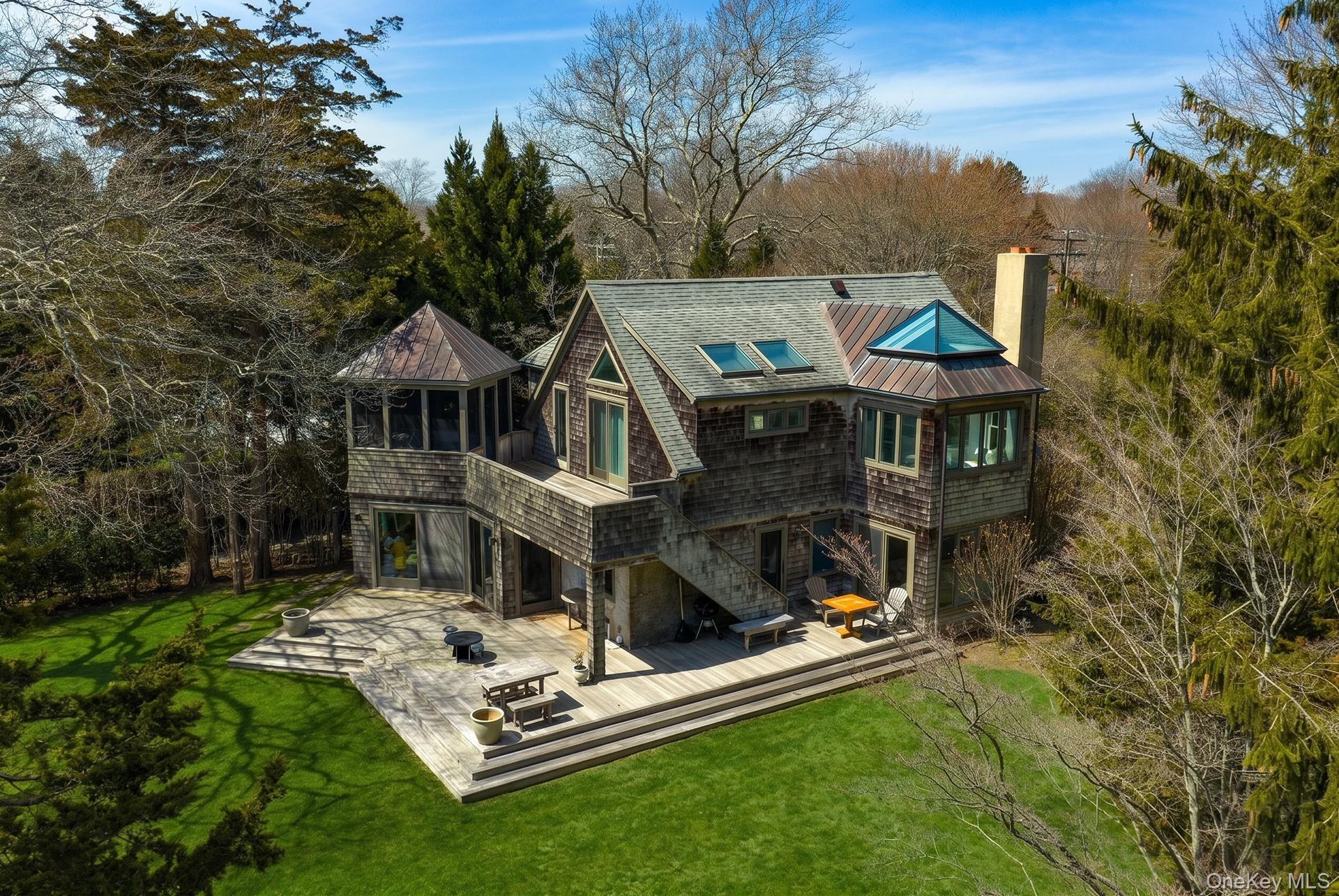 60 Skimhampton Road East Hampton, NY 11937 - Photo 33 of 37 a view of a house with a yard porch and sitting area