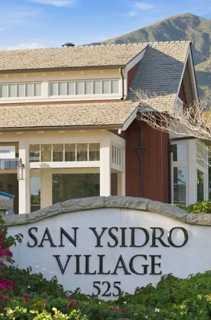 a view of a building with a yard
