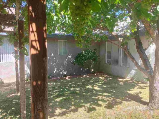 609 East Wilson Avenue Ridgecrest, CA 93555 - Photo 32 of 32 a view of a house with a tree