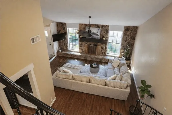 a living room with furniture and a fireplace