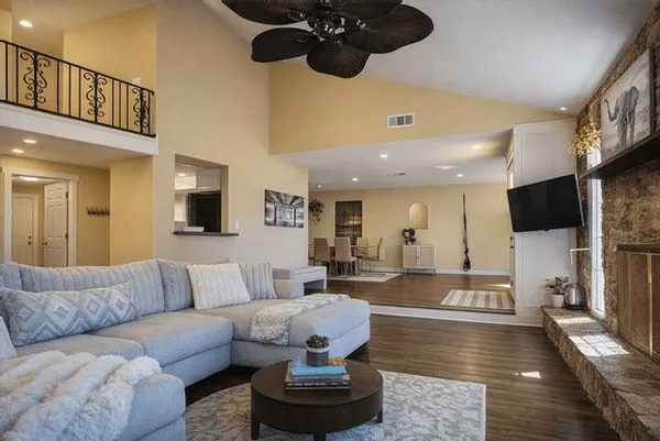 a living room with furniture and a flat screen tv