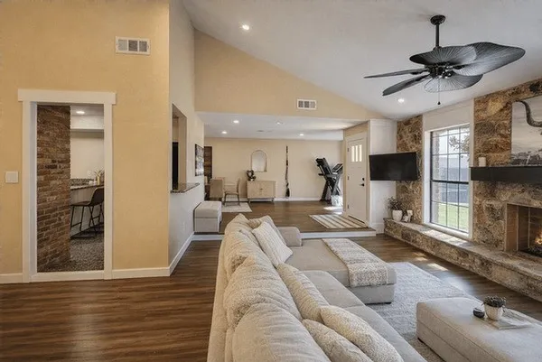 a living room with furniture and a flat screen tv