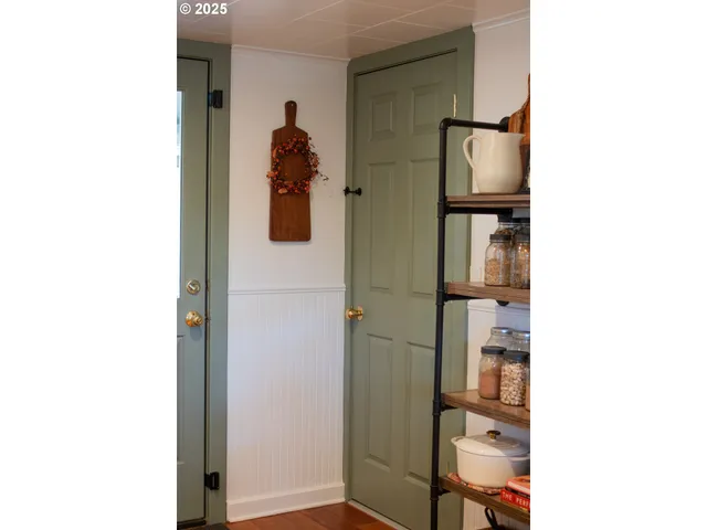 a picture of a bathroom with a shower and a mirror