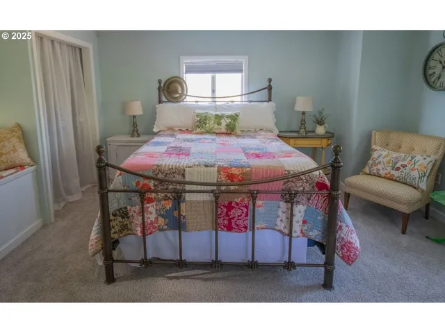 a living room with furniture a couch and a large window