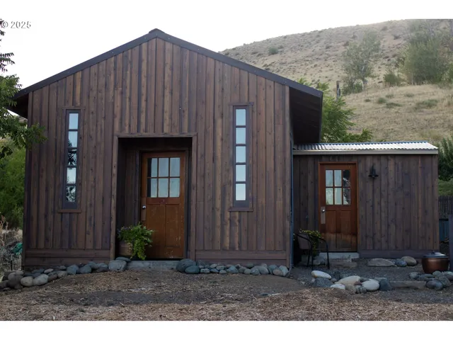 a backyard of a house with seating space