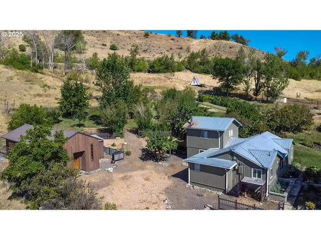 a view of a terrace with a garden and outdoor seating