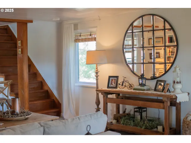 a view of a livingroom with furniture and a window