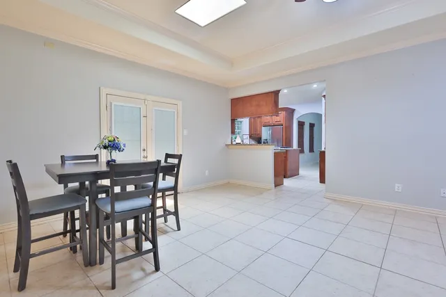 a view of a livingroom with furniture and chandelier fan