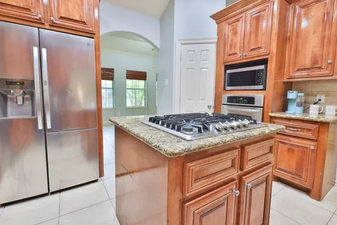 a dining room with furniture and chandelier