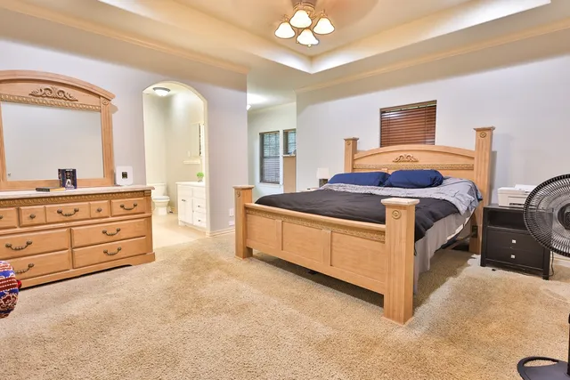 a spacious bathroom with a double vanity sink a mirror and a shower