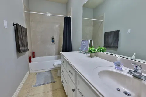 an empty room with furniture and window