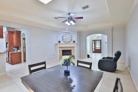 a kitchen with granite countertop a sink a counter top space and stainless steel appliances