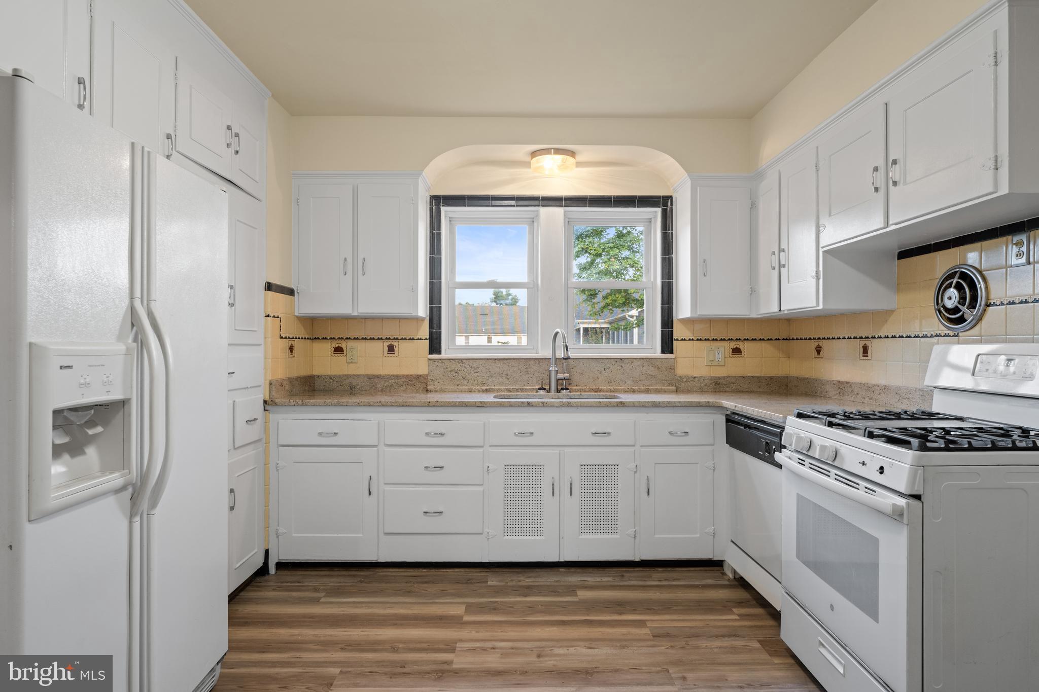 1547 East Wheat Road Vineland, NJ 08360 - Photo 16 of 32 a kitchen with granite countertop a sink stainless steel appliances and cabinets
