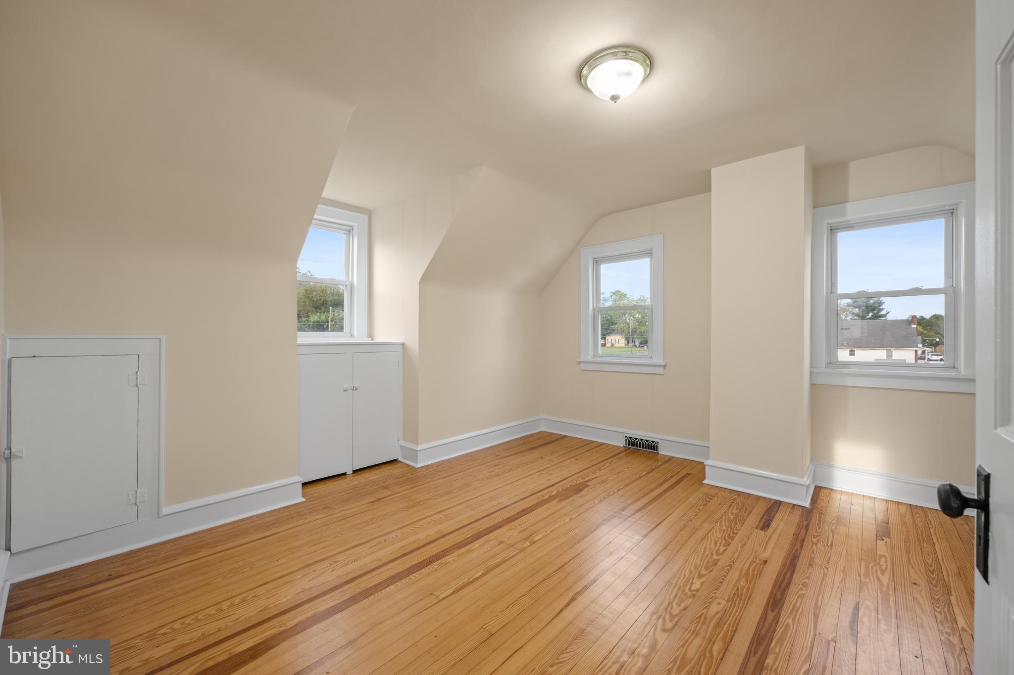 1547 East Wheat Road Vineland, NJ 08360 - Photo 25 of 32 wooden floor in an empty room with a window