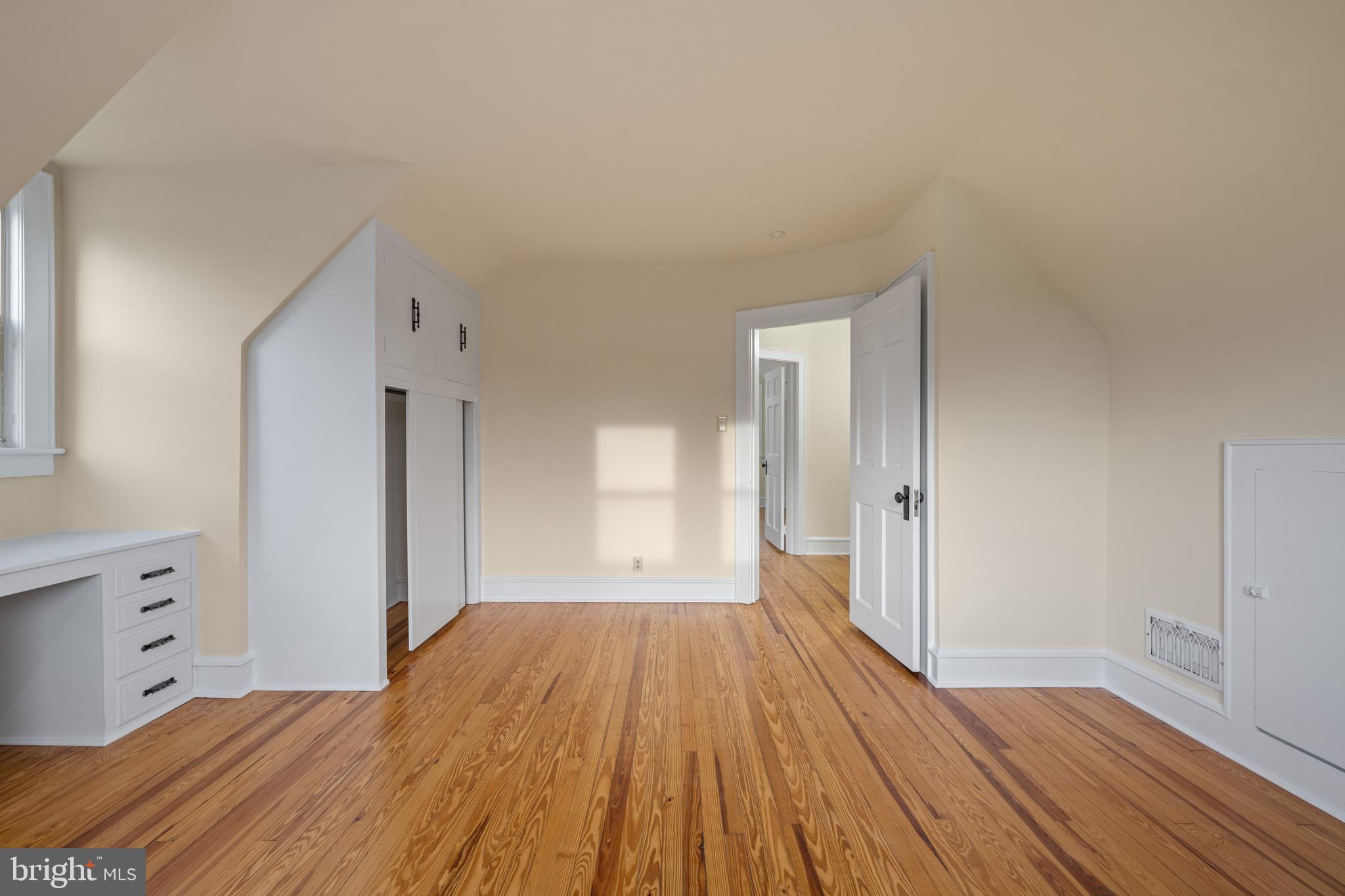 1547 East Wheat Road Vineland, NJ 08360 - Photo 28 of 32 a big room with wooden floor and bathroom view
