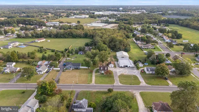 an aerial view of a house with a lake view