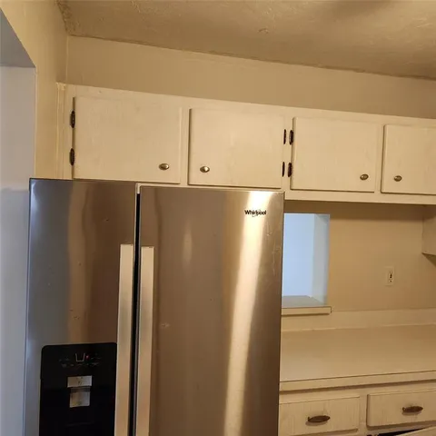 a view of cabinets and wooden floor