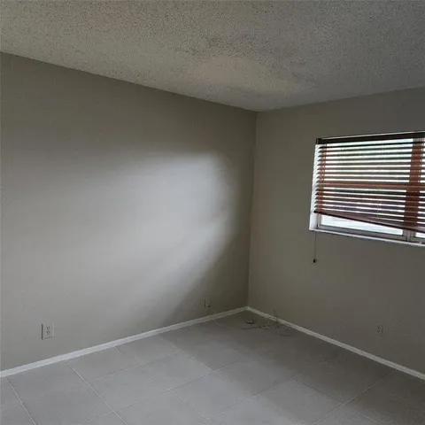 a bathroom with a bath tub a toilet and a shower