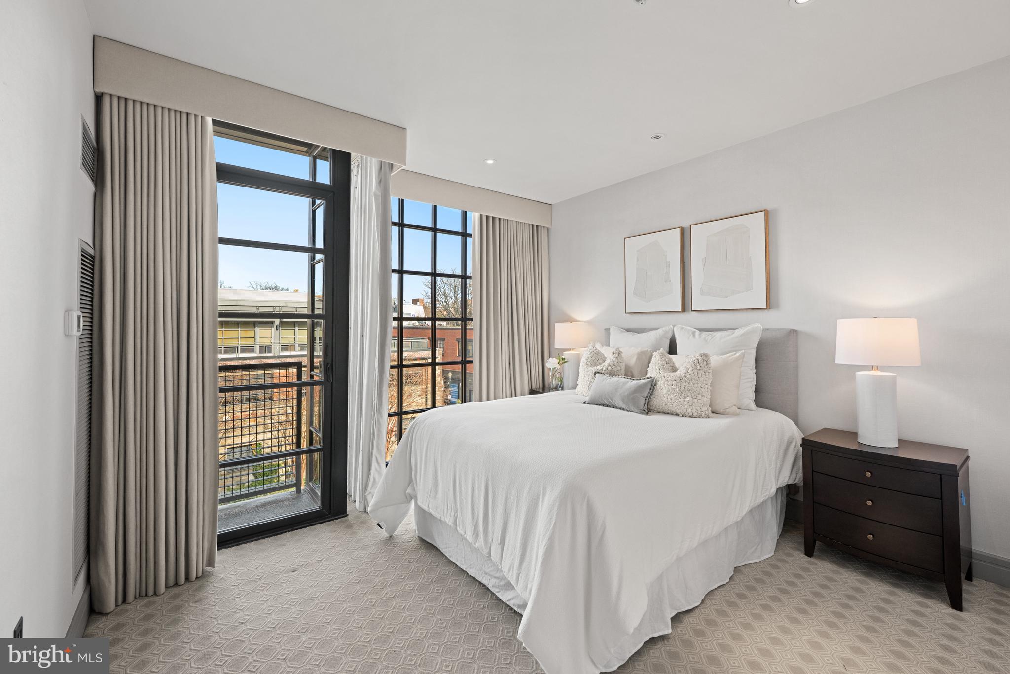 3303 Water Street Northwest, Unit 7E Washington, DC 20007 - Photo 17 of 29 a bedroom with a bed and a window