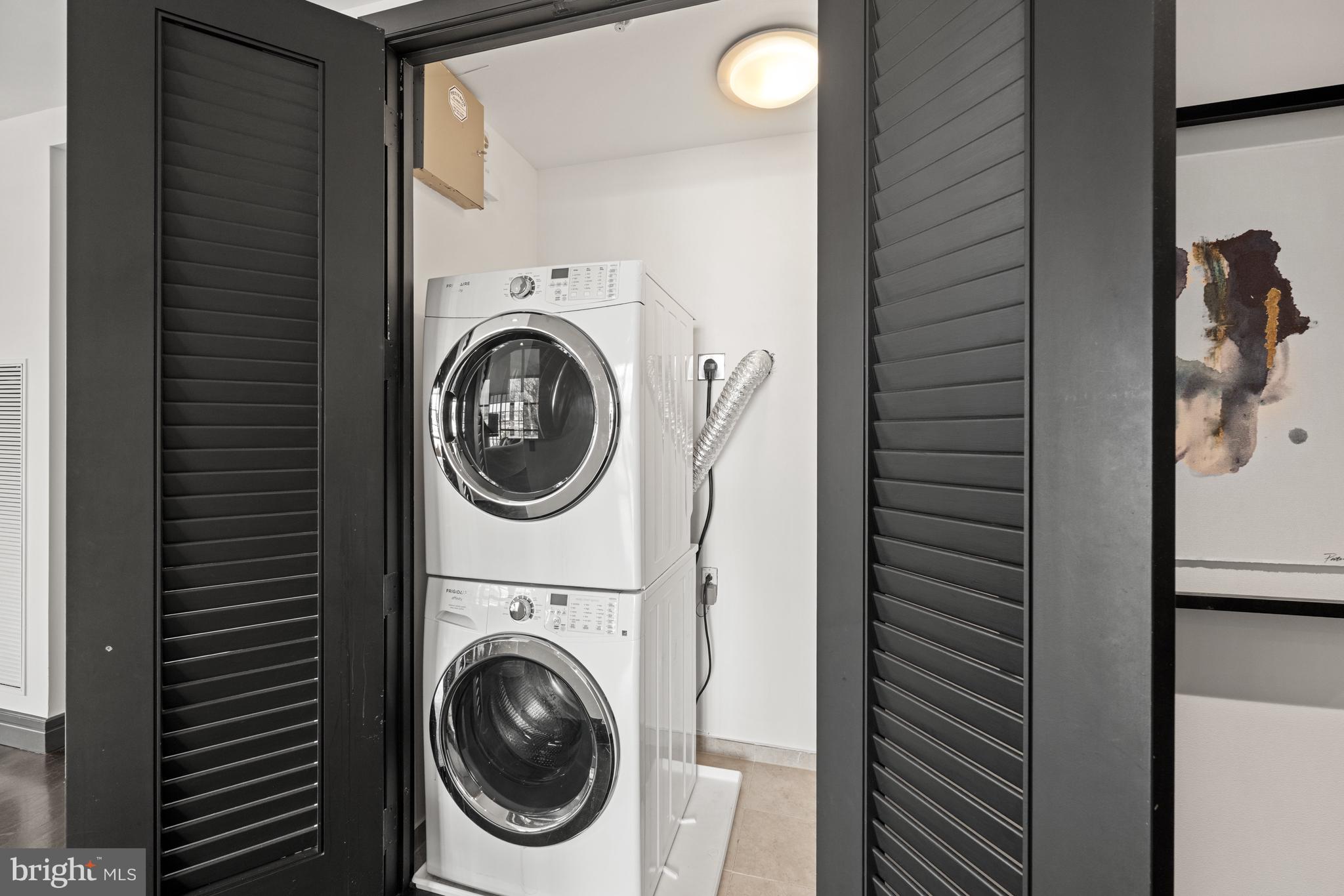 3303 Water Street Northwest, Unit 7E Washington, DC 20007 - Photo 20 of 29 a utility room with dryer and washer