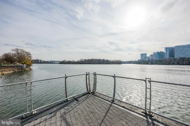 a view of a lake with houses in the back