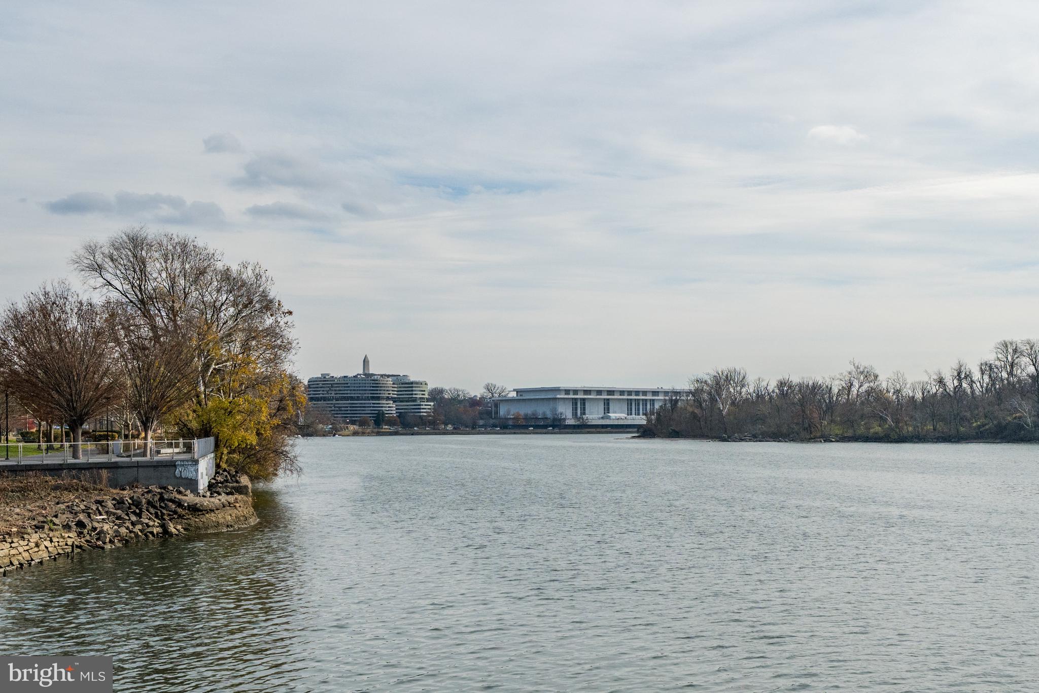 3303 Water Street Northwest, Unit 7E Washington, DC 20007 - Photo 27 of 29 a view of a lake with houses in the back