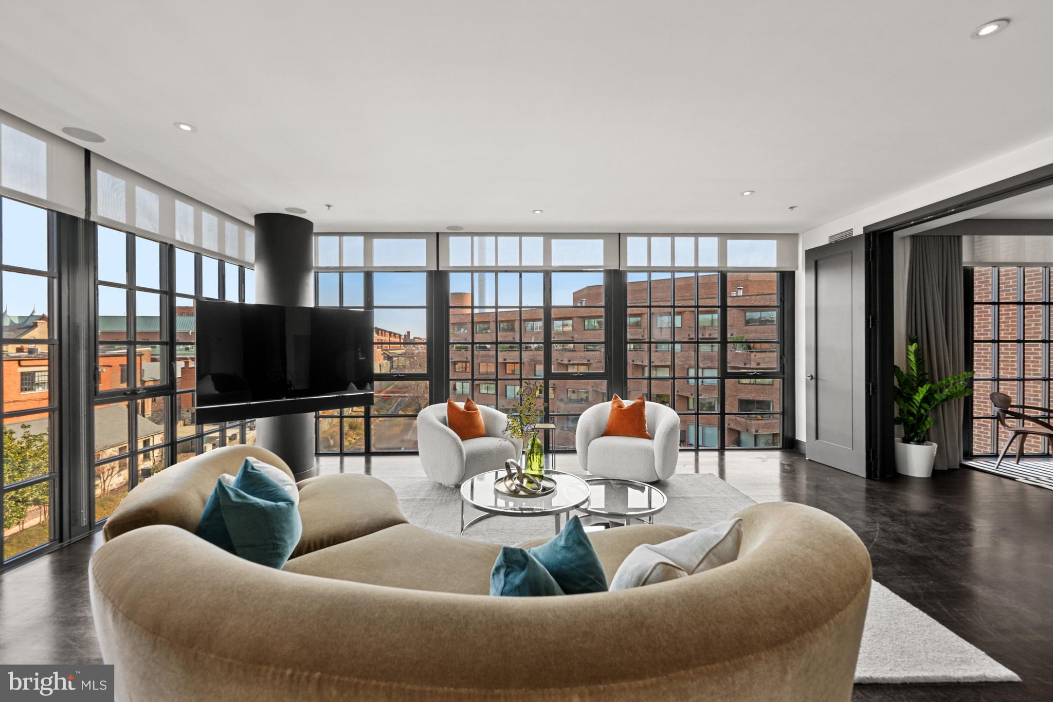 3303 Water Street Northwest, Unit 7E Washington, DC 20007 - Photo 4 of 29 a living room with furniture and a flat screen tv