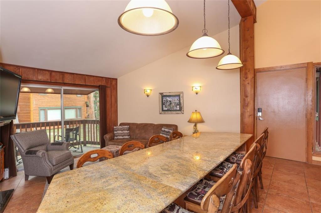 1080 Ski Hill Road, Unit 9 Breckenridge, CO 80424 - Photo 2 of 25 a view of a dining room with furniture window and outside view