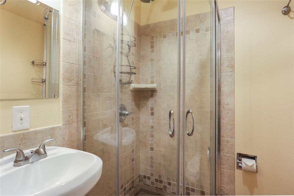 1080 Ski Hill Road, Unit 9 Breckenridge, CO 80424 - Photo 17 of 25 a bathroom with a sink and shower