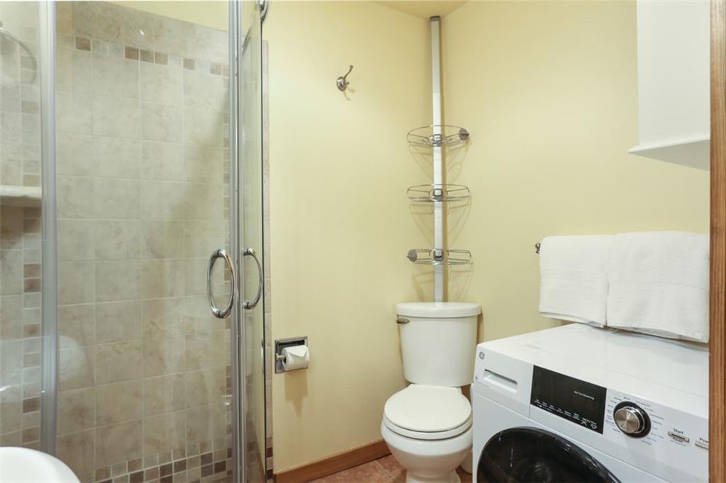 1080 Ski Hill Road, Unit 9 Breckenridge, CO 80424 - Photo 18 of 25 a bathroom with a toilet and a shower