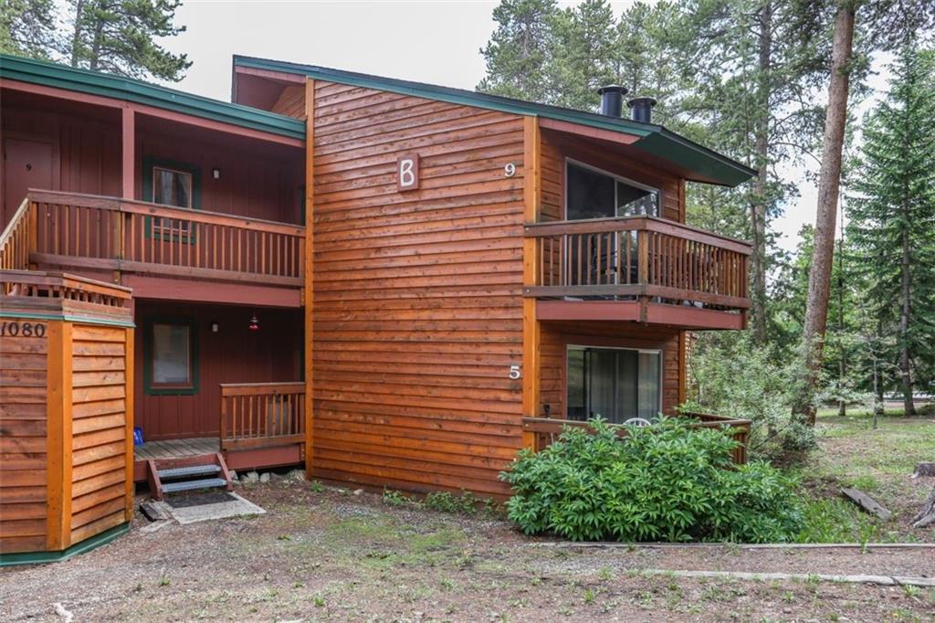 1080 Ski Hill Road, Unit 9 Breckenridge, CO 80424 - Photo 24 of 25 a front view of a house with a yard