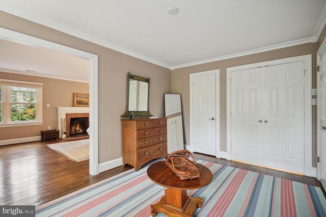 a bathroom with a tub a double vanity sink and mirror