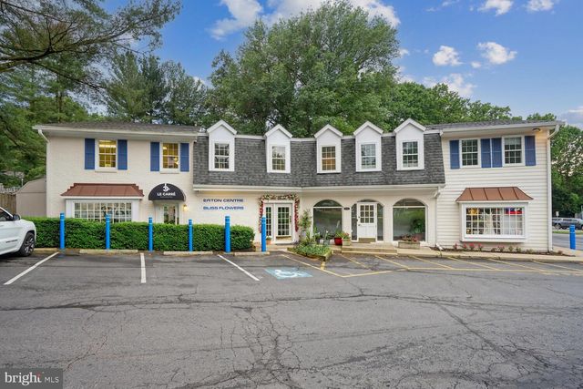 a view of cars parked in front of a building