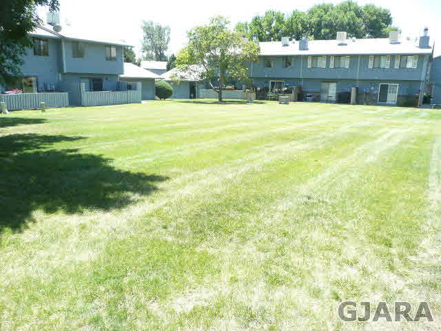 2721 Patterson Road, Unit 402 Grand Junction, CO 81506 - Photo 1 of 22 a view of a house with a swimming pool