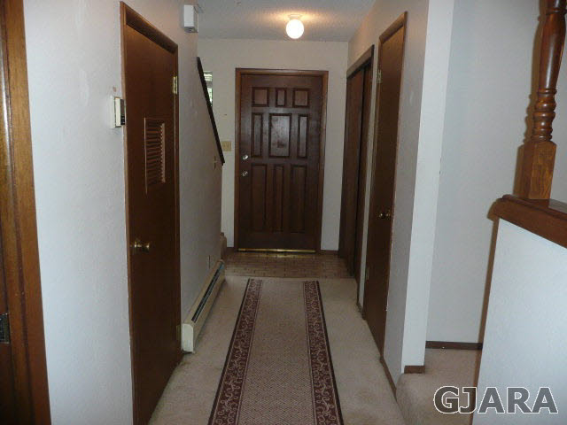 2721 Patterson Road, Unit 402 Grand Junction, CO 81506 - Photo 7 of 22 a view of hallway with wooden floor