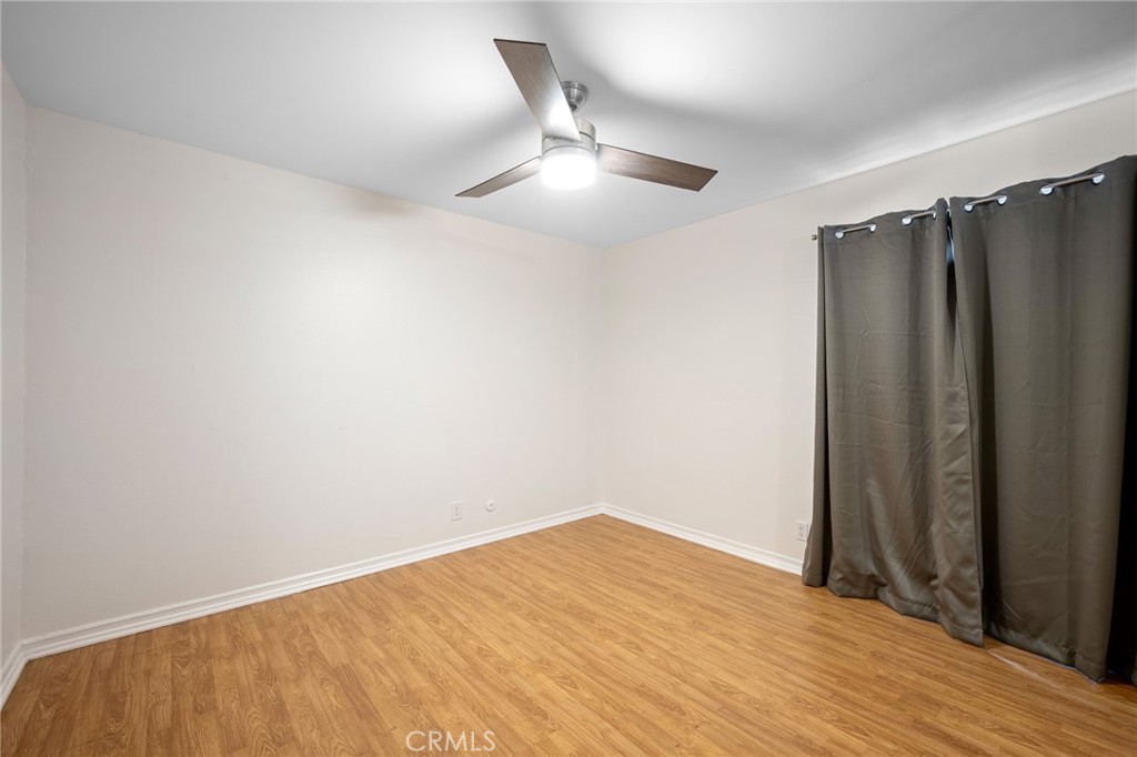 15425 Sherman Way, Unit 107A Van Nuys, CA 91406 - Photo 12 of 23 wooden floor in an empty room