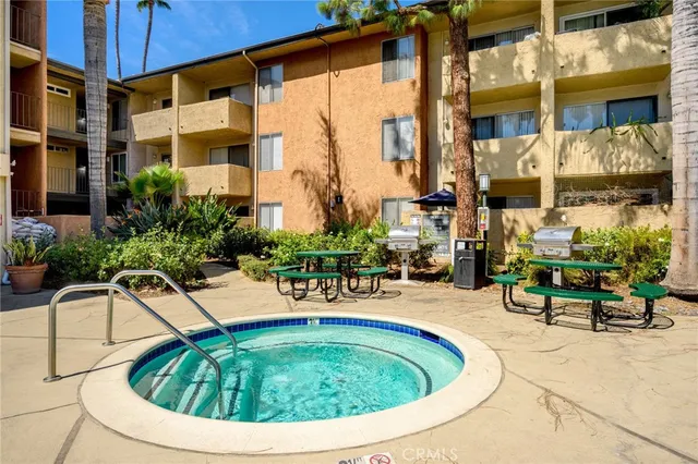 a view of swimming pool with outdoor seating