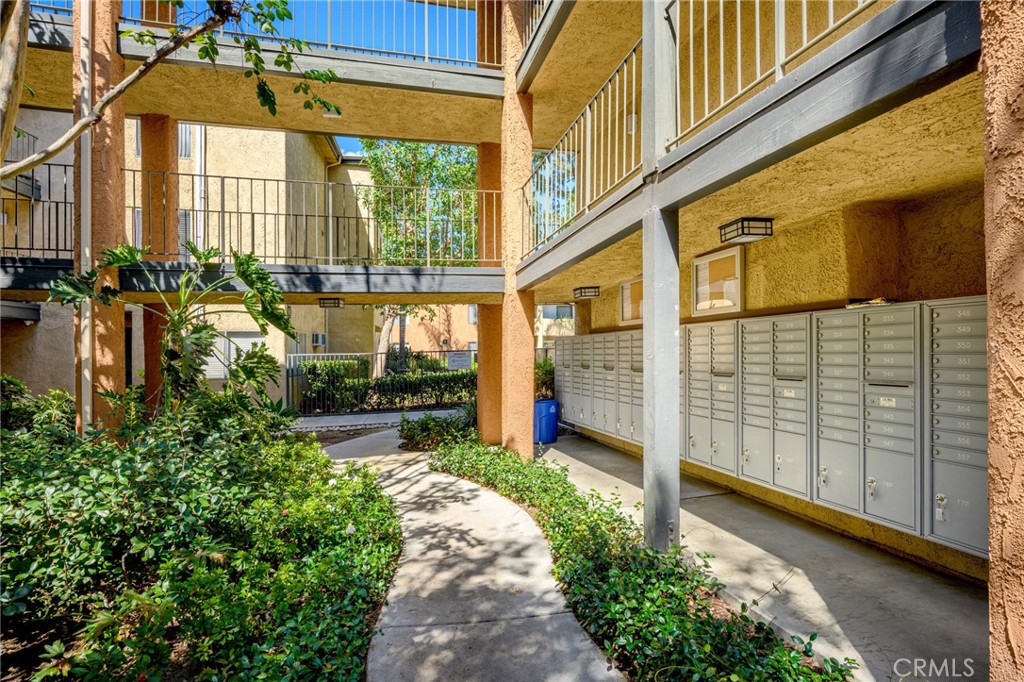 15425 Sherman Way, Unit 107A Van Nuys, CA 91406 - Photo 22 of 23 a view of a pathway along the building