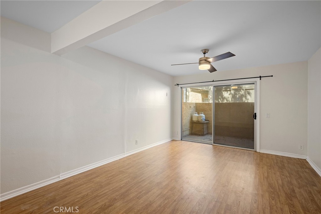 15425 Sherman Way, Unit 107A Van Nuys, CA 91406 - Photo 4 of 23 wooden floor in an empty room with a window