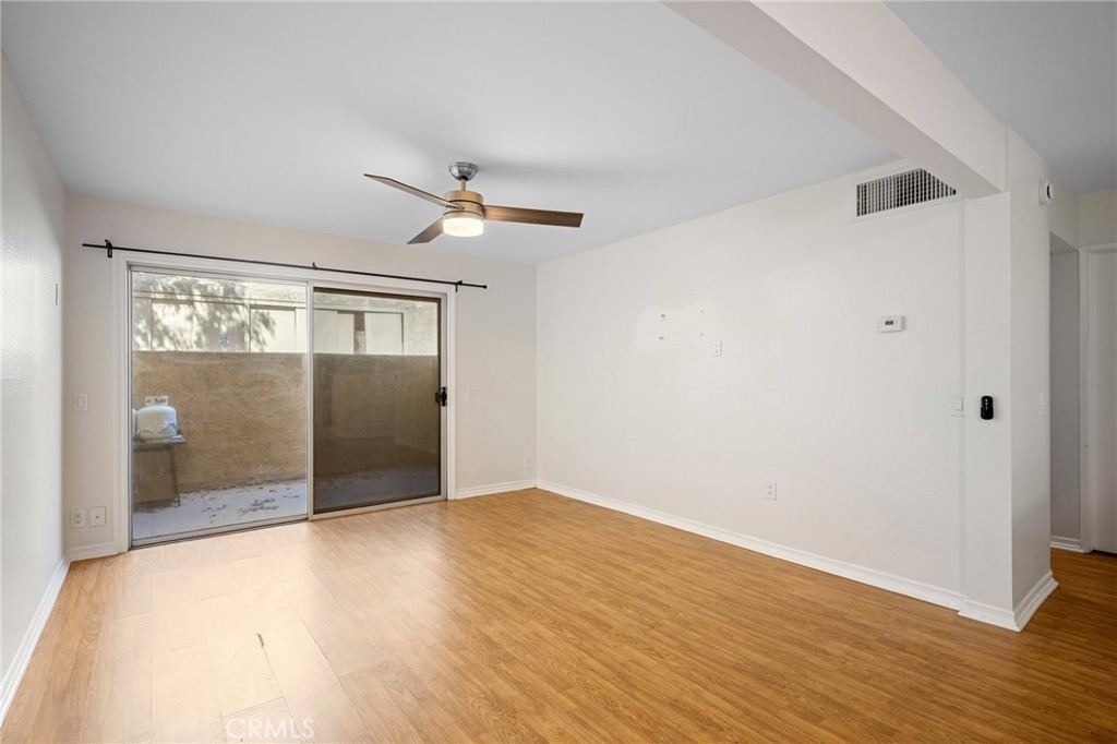 15425 Sherman Way, Unit 107A Van Nuys, CA 91406 - Photo 7 of 23 a view of wooden floor in an empty room