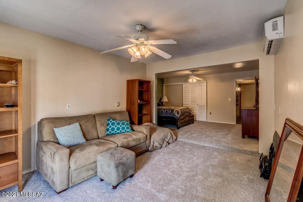 1901 West Romany Road Tucson, AZ 85713 - Photo 18 of 37 a living room with furniture and a chandelier