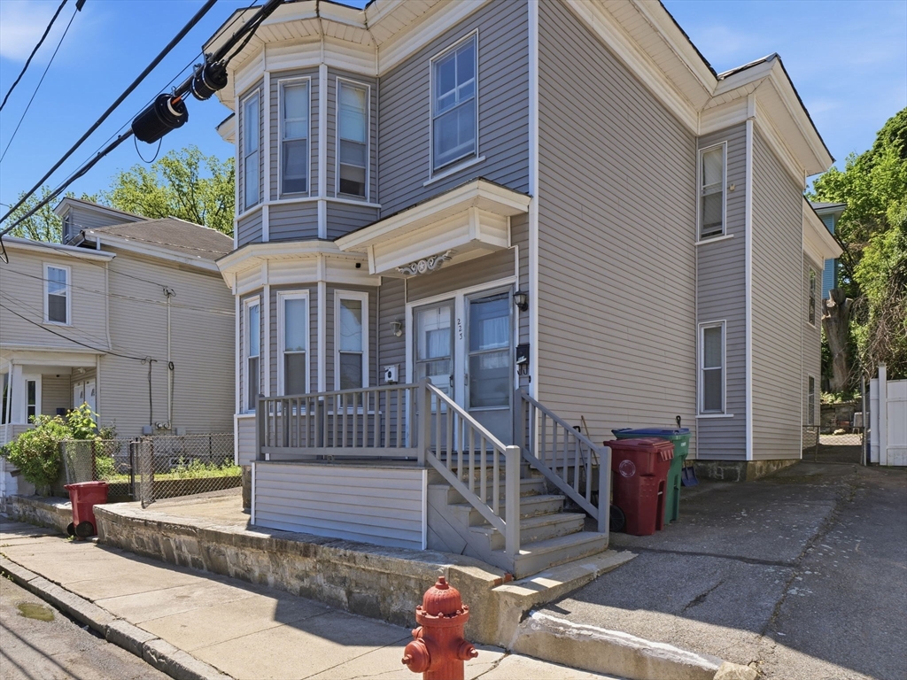 223 Stackpole Street Lowell, MA 01852 - Photo 34 of 42 a view of front of house with a yard
