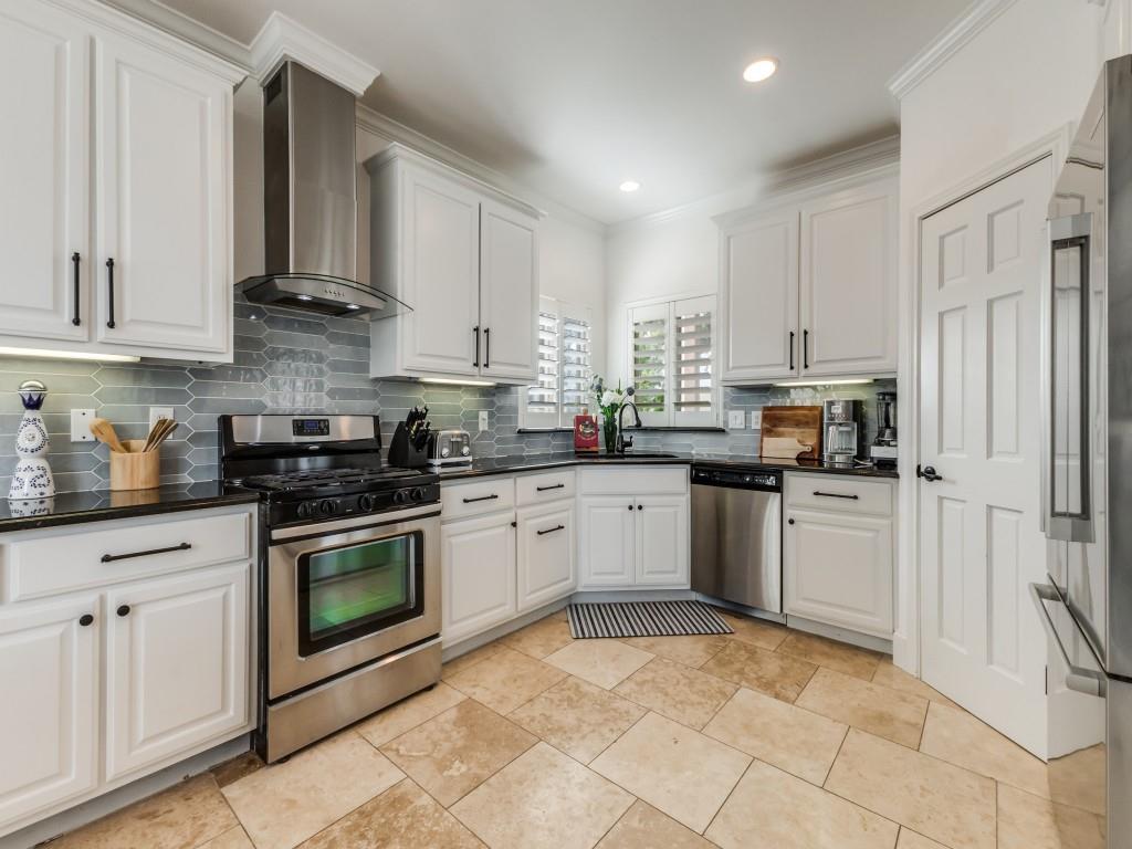 5848 Lago Vista Athens, TX 75752 - Photo 7 of 33 a kitchen with stainless steel appliances granite countertop a refrigerator sink and cabinets